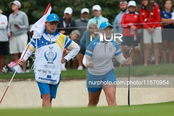 GAINESVILLE, VIRGINIA - SEPTEMBER 13: Emily Kristine Pedersen of Team Europe celebrates as her teammate Maja Stark makes her putt on the 7th...