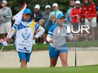 GAINESVILLE, VIRGINIA - SEPTEMBER 13: Emily Kristine Pedersen of Team Europe celebrates as her teammate Maja Stark makes her putt on the 7th...