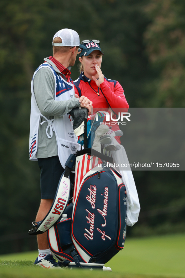 GAINESVILLE, VIRGINIA - SEPTEMBER 13: Jennifer Kupcho of the United States interact with her caddie on the 8th green during Foursome Matches...