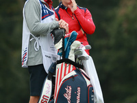 GAINESVILLE, VIRGINIA - SEPTEMBER 13: Jennifer Kupcho of the United States interact with her caddie on the 8th green during Foursome Matches...