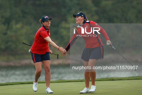 GAINESVILLE, VIRGINIA - SEPTEMBER 13: Jennifer Kupcho of the United States (R) celebrates with teammate Ally Ewing (L) on the 9th green duri...