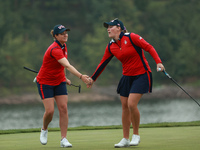 GAINESVILLE, VIRGINIA - SEPTEMBER 13: Jennifer Kupcho of the United States (R) celebrates with teammate Ally Ewing (L) on the 9th green duri...