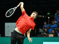 Alexander Blockx (BEL) is in action during the 2024 Davis Cup Finals Group Stage Bologna match between Italy and Belgium at Unipol Arena in...