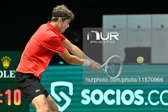 Alexander Blockx (BEL) is in action during the 2024 Davis Cup Finals Group Stage Bologna match between Italy and Belgium at Unipol Arena in...