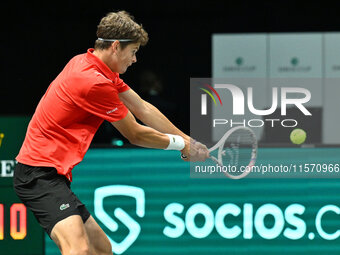 Alexander Blockx (BEL) is in action during the 2024 Davis Cup Finals Group Stage Bologna match between Italy and Belgium at Unipol Arena in...