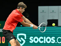 Alexander Blockx (BEL) is in action during the 2024 Davis Cup Finals Group Stage Bologna match between Italy and Belgium at Unipol Arena in...