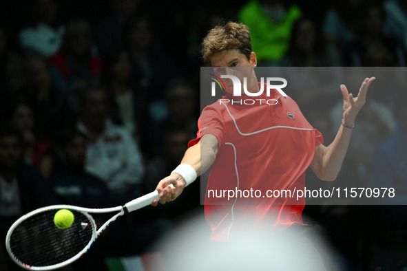 Alexander Blockx (BEL) is in action during the 2024 Davis Cup Finals Group Stage Bologna match between Italy and Belgium at Unipol Arena in...