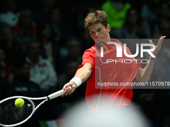 Alexander Blockx (BEL) is in action during the 2024 Davis Cup Finals Group Stage Bologna match between Italy and Belgium at Unipol Arena in...