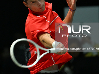 Alexander Blockx (BEL) is in action during the 2024 Davis Cup Finals Group Stage Bologna match between Italy and Belgium at Unipol Arena in...