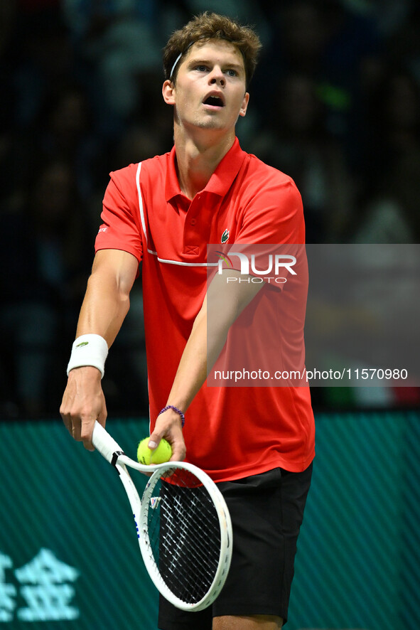 Alexander Blockx (BEL) is in action during the 2024 Davis Cup Finals Group Stage Bologna match between Italy and Belgium at Unipol Arena in...