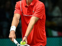 Alexander Blockx (BEL) is in action during the 2024 Davis Cup Finals Group Stage Bologna match between Italy and Belgium at Unipol Arena in...