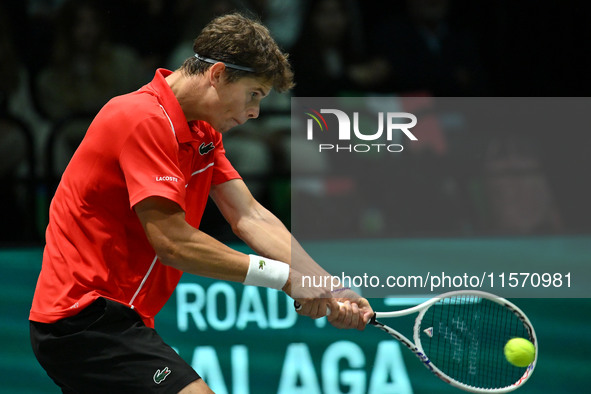 Alexander Blockx (BEL) is in action during the 2024 Davis Cup Finals Group Stage Bologna match between Italy and Belgium at Unipol Arena in...