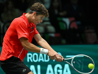 Alexander Blockx (BEL) is in action during the 2024 Davis Cup Finals Group Stage Bologna match between Italy and Belgium at Unipol Arena in...