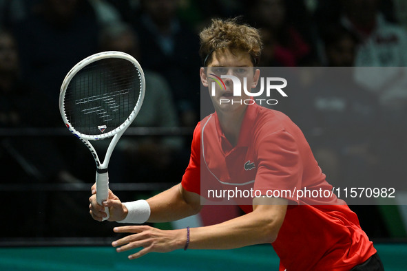 Alexander Blockx (BEL) is in action during the 2024 Davis Cup Finals Group Stage Bologna match between Italy and Belgium at Unipol Arena in...