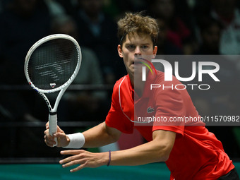 Alexander Blockx (BEL) is in action during the 2024 Davis Cup Finals Group Stage Bologna match between Italy and Belgium at Unipol Arena in...