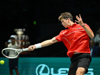 Alexander Blockx (BEL) is in action during the 2024 Davis Cup Finals Group Stage Bologna match between Italy and Belgium at Unipol Arena in...