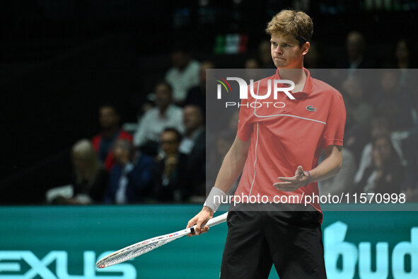 Alexander Blockx (BEL) is in action during the 2024 Davis Cup Finals Group Stage Bologna match between Italy and Belgium at Unipol Arena in...