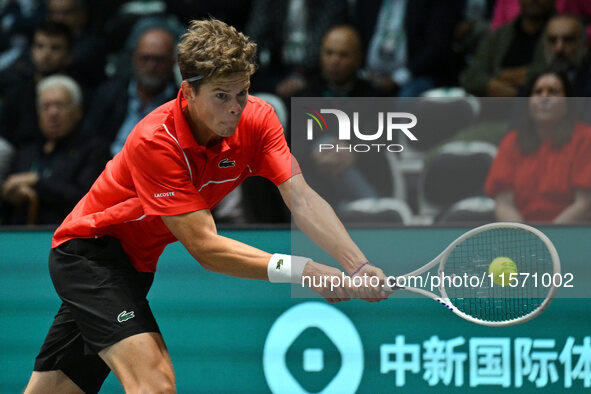 Alexander Blockx (BEL) is in action during the 2024 Davis Cup Finals Group Stage Bologna match between Italy and Belgium at Unipol Arena in...