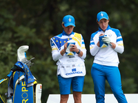 GAINESVILLE, VIRGINIA - SEPTEMBER 13: Carlota Ciganda of Team Europe makes notes with her caddie at the 9th tee during Day One of the Solhei...