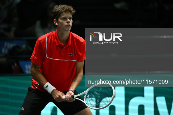 Alexander Blockx (BEL) is in action during the 2024 Davis Cup Finals Group Stage Bologna match between Italy and Belgium at Unipol Arena in...