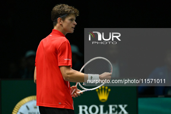 Alexander Blockx (BEL) is in action during the 2024 Davis Cup Finals Group Stage Bologna match between Italy and Belgium at Unipol Arena in...