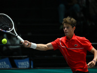 Alexander Blockx (BEL) is in action during the 2024 Davis Cup Finals Group Stage Bologna match between Italy and Belgium at Unipol Arena in...