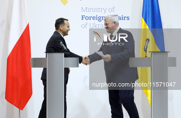 Minister of Foreign Affairs of Ukraine Andrii Sybiha shakes hands with Minister of Foreign Affairs of the Republic of Poland Radoslaw Sikors...