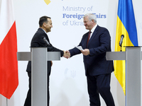 Minister of Foreign Affairs of Ukraine Andrii Sybiha shakes hands with Minister of Foreign Affairs of the Republic of Poland Radoslaw Sikors...