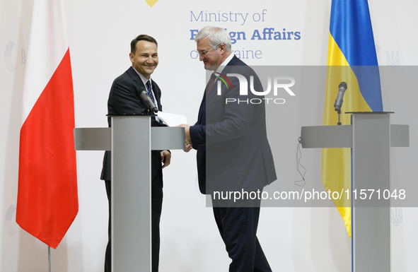 Minister of Foreign Affairs of Ukraine Andrii Sybiha shakes hands with Minister of Foreign Affairs of the Republic of Poland Radoslaw Sikors...