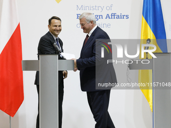 Minister of Foreign Affairs of Ukraine Andrii Sybiha shakes hands with Minister of Foreign Affairs of the Republic of Poland Radoslaw Sikors...