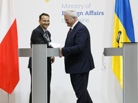 Minister of Foreign Affairs of Ukraine Andrii Sybiha shakes hands with Minister of Foreign Affairs of the Republic of Poland Radoslaw Sikors...