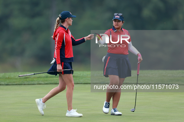 GAINESVILLE, VIRGINIA - SEPTEMBER 13: Lilia Vu of Team USA celebrates with Sarah Schmelzel of the United States on the 9th green during Day...