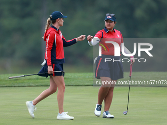 GAINESVILLE, VIRGINIA - SEPTEMBER 13: Lilia Vu of Team USA celebrates with Sarah Schmelzel of the United States on the 9th green during Day...