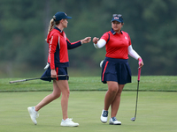 GAINESVILLE, VIRGINIA - SEPTEMBER 13: Lilia Vu of Team USA celebrates with Sarah Schmelzel of the United States on the 9th green during Day...