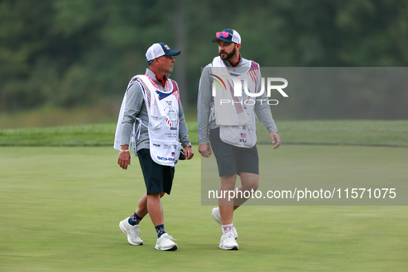 GAINESVILLE, VIRGINIA - SEPTEMBER 13: The caddies for Lilia Vu  of Team USA and Sarah Schmelzel of the United States walk off of the 9th gre...