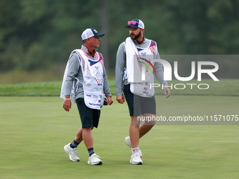 GAINESVILLE, VIRGINIA - SEPTEMBER 13: The caddies for Lilia Vu  of Team USA and Sarah Schmelzel of the United States walk off of the 9th gre...