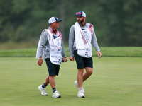 GAINESVILLE, VIRGINIA - SEPTEMBER 13: The caddies for Lilia Vu  of Team USA and Sarah Schmelzel of the United States walk off of the 9th gre...