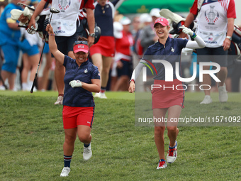 GAINESVILLE, VIRGINIA - SEPTEMBER 13: Megan Khang of the United States and Nelly Korda of the United States walk from the 1st tee during Day...