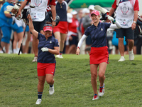 GAINESVILLE, VIRGINIA - SEPTEMBER 13: Megan Khang of the United States and Nelly Korda of the United States walk from the 1st tee during Day...