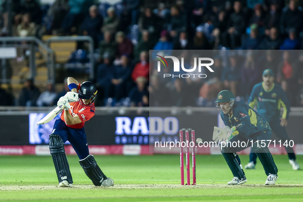 Jacob Bethell of England edges the ball to the boundary for 4 as Josh Inglis of Australia watches during the Second Vitality T20 Internation...