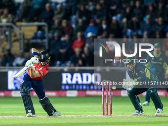 Jacob Bethell of England edges the ball to the boundary for 4 as Josh Inglis of Australia watches during the Second Vitality T20 Internation...