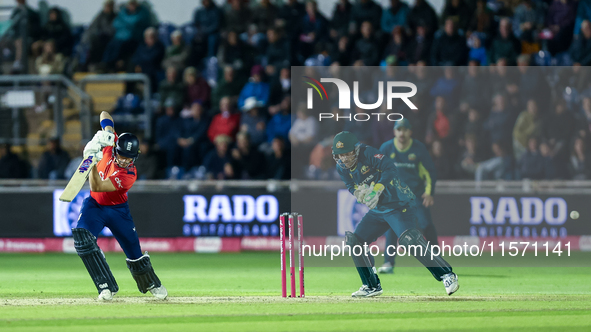 Jacob Bethell of England edges the ball to the boundary for 4 as Josh Inglis of Australia watches during the Second Vitality T20 Internation...