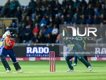 Jacob Bethell of England edges the ball to the boundary for 4 as Josh Inglis of Australia watches during the Second Vitality T20 Internation...