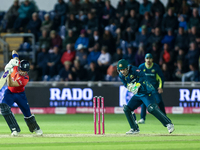 Jacob Bethell of England edges the ball to the boundary for 4 as Josh Inglis of Australia watches during the Second Vitality T20 Internation...