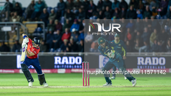 Jacob Bethell of England edges the ball to the boundary for 4 as Josh Inglis of Australia watches during the Second Vitality T20 Internation...