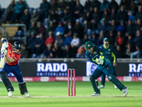 Jacob Bethell of England edges the ball to the boundary for 4 as Josh Inglis of Australia watches during the Second Vitality T20 Internation...