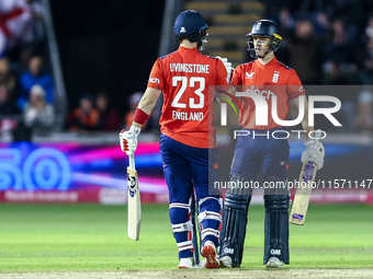 #23, Liam Livingstone of England, is congratulated for his half-century by #82, Jacob Bethell, during the Second Vitality T20 International...