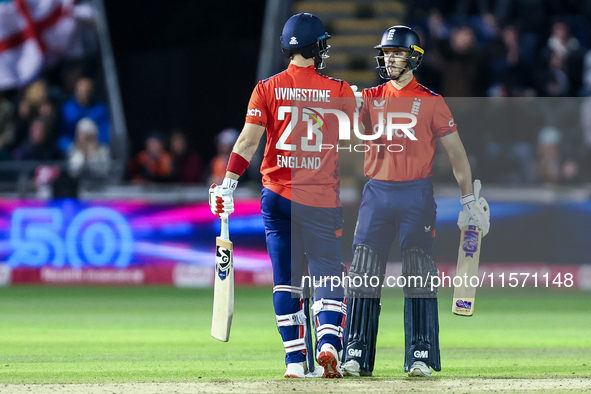 #23, Liam Livingstone of England, is congratulated for his half-century by #82, Jacob Bethell, during the Second Vitality T20 International...