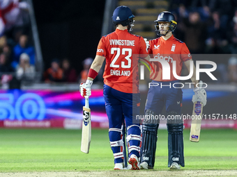 #23, Liam Livingstone of England, is congratulated for his half-century by #82, Jacob Bethell, during the Second Vitality T20 International...