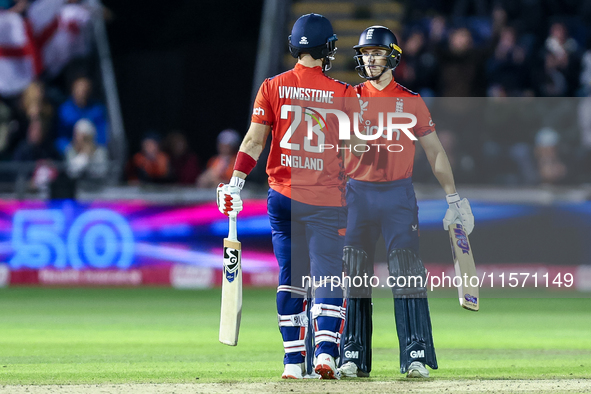 #23, Liam Livingstone of England, is congratulated for his half-century by #82, Jacob Bethell, during the Second Vitality T20 International...